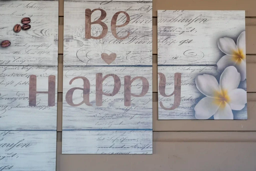 Sign displaying 'Be Happy', associated with a happiness improvement article.