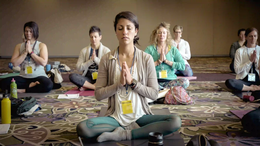 Group of women engaged in a meditation session