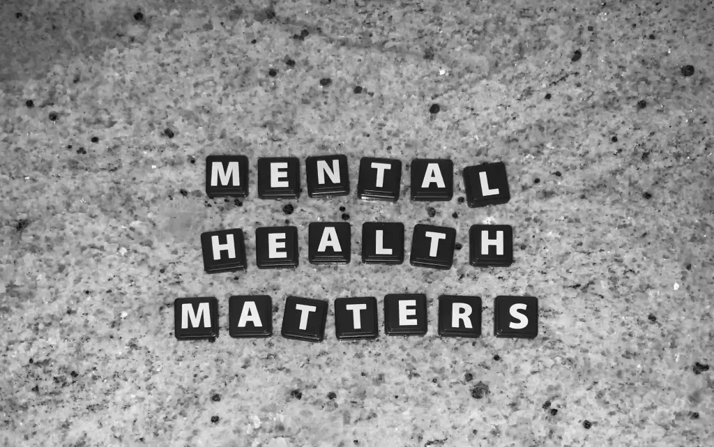 Letters spelling "Mental Health Matters" in nature-themed setting