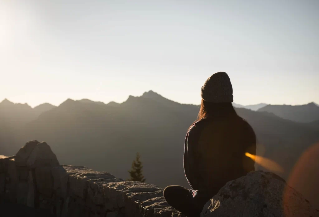Sunrise meditation in the mountainous terrain